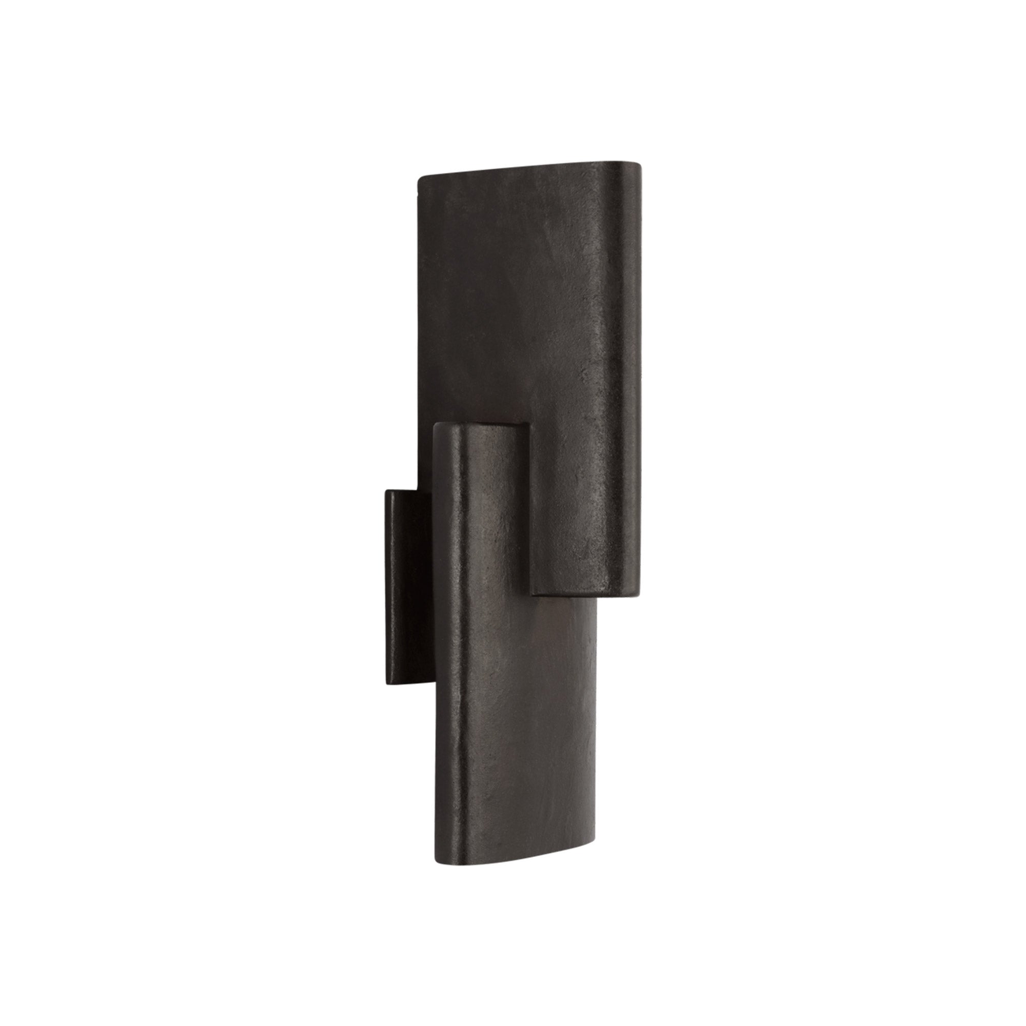 Textured metal sconce with intersecting forms, casting dynamic light and shadow.