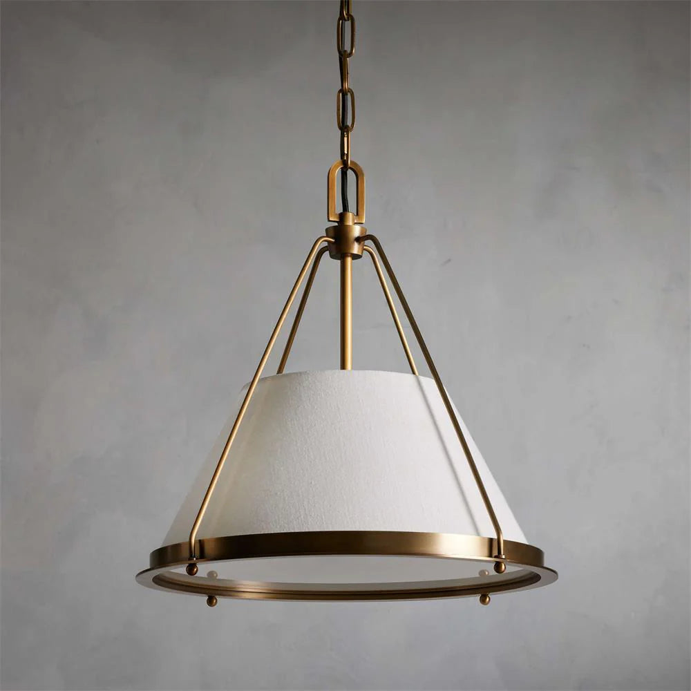 Melton Pendant Light – a striking blend of smooth brass and textured linen fabric, featuring industrial-inspired brass arms and flared shades, elegantly accented with brass detailing at the base.