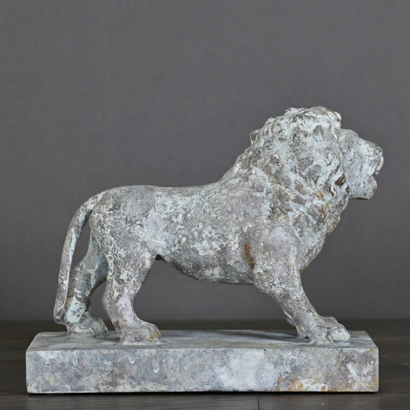 XIXth Century Roaring Lion – inspired by Empire-era mansion parks, with a distinctive blue-grey patina, perfect as an ornament or bookends.