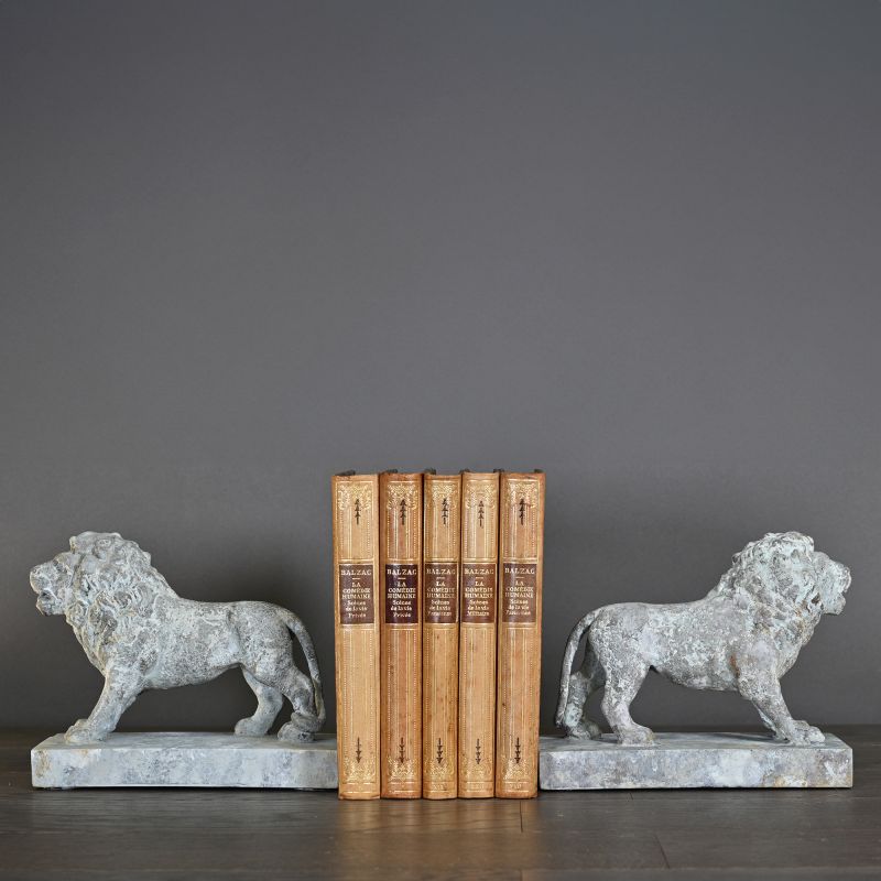 XIXth Century Roaring Lion – inspired by Empire-era mansion parks, with a distinctive blue-grey patina, perfect as an ornament or bookends.