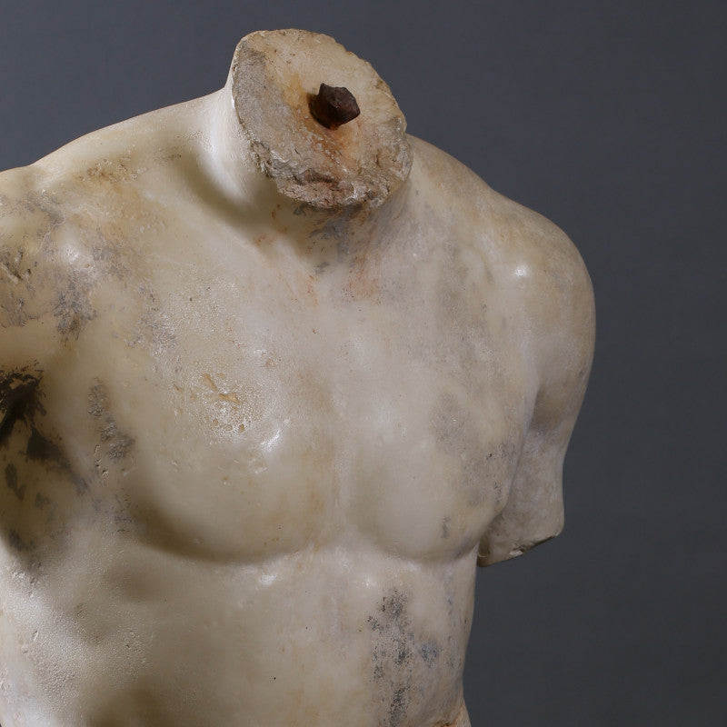 Torso Discophorus – a fragmentary reproduction of Naucydes' 4th-century BC discus thrower, inspired by the lost bronze original, with a full replica housed in the Louvre Museum.