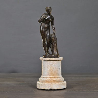 Venus with Apple – elegant sculpture inspired by Greek mythology, standing on a hand-made sandstone column with an antique bronze patina.