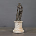 Venus with Apple – elegant sculpture inspired by Greek mythology, standing on a hand-made sandstone column with an antique bronze patina.