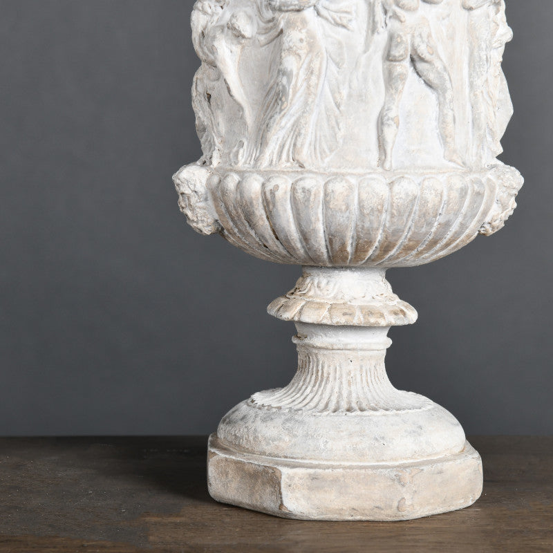 19th-Century Classical-Style Medici Vase – ceramic replica with a Greek scene, inspired by temple sculptures, featuring an aged patina finish.